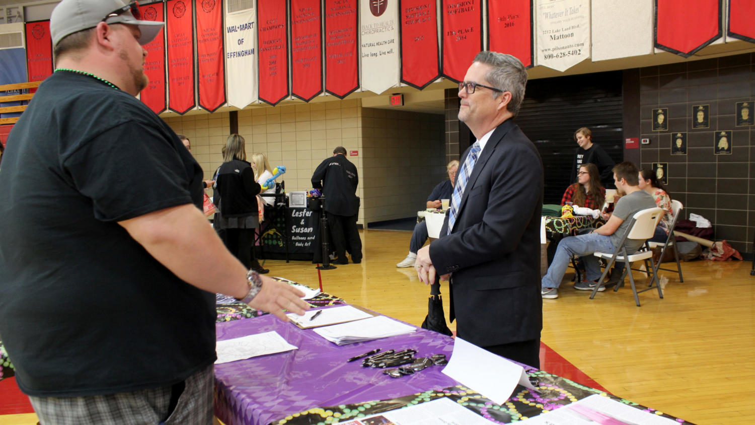 College president Josh Bullock stops to chat with Navigator News business manager Steven Oliver.