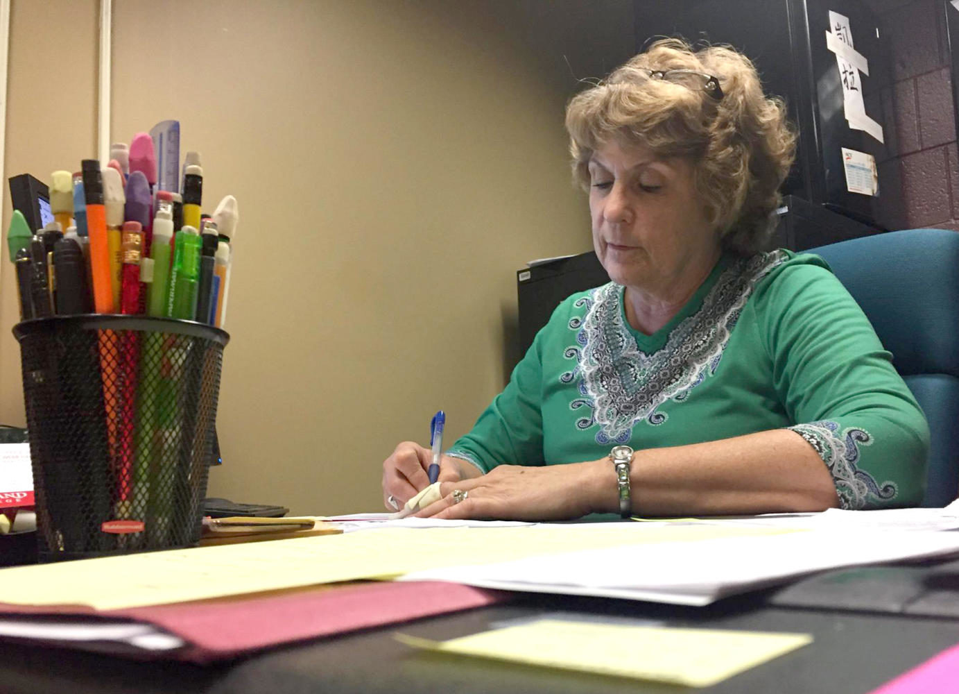 Karla Miller looks over paperwork in her office in the days leading up to the Fall 2017 semester. Miller is the Director of Tutoring and Testing, and can be found in her office in Webb 041.