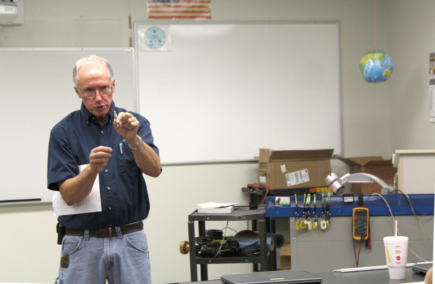 Drake explains how to create an electormagnet by wrapping copper wire around an iron nail and attaching it to a battery.