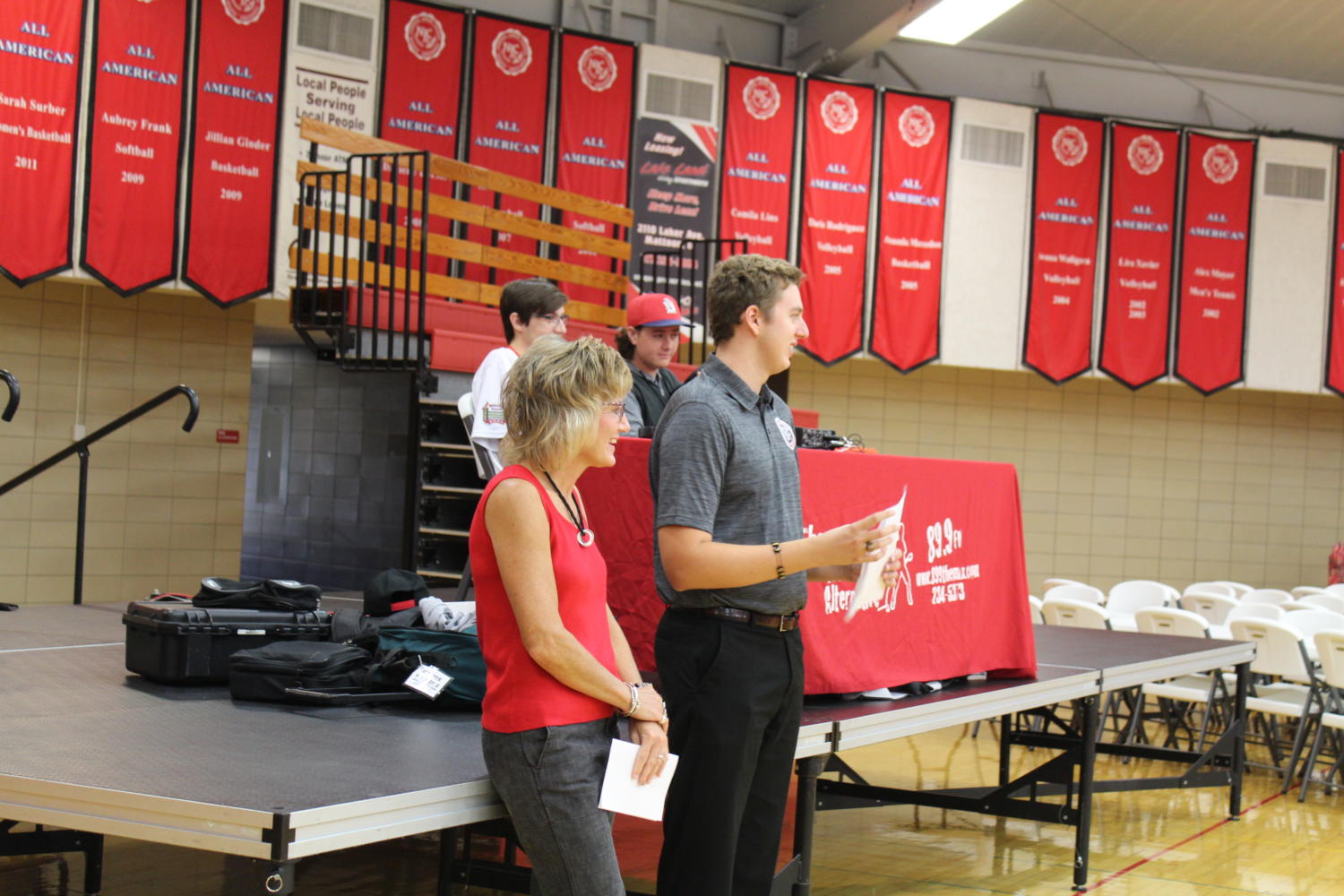 Student Government President Brock Hammond and music instructor Nancy Caldwell lead the students in singing Laker Loyalty.