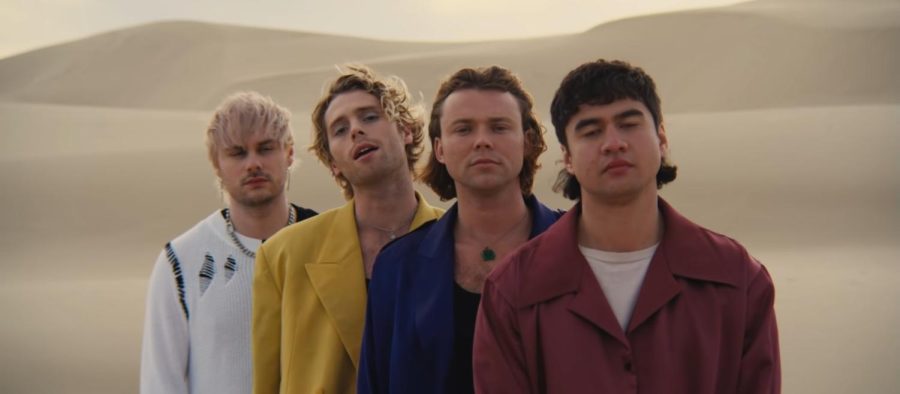 5SOS+band+members+Michael+Clifford%2C+Luke+Hemmings%2C+Ashton+Irwin+and+Calum+Hood+pose+in+a+line+in+their+latest+music+video+for+Complete+Mess.+Image+retrieved+from+Complete+Mess+official+music+video.