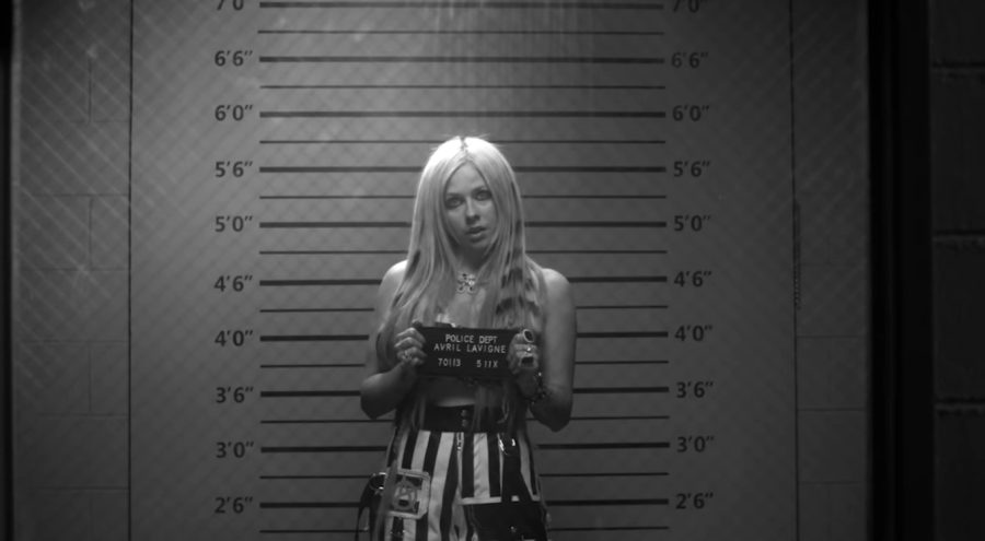 Avril Lavigne poses in the music video for her collaboration with Blackbear, Love It When You Hate Me. Love It When You Hate Me official music video.