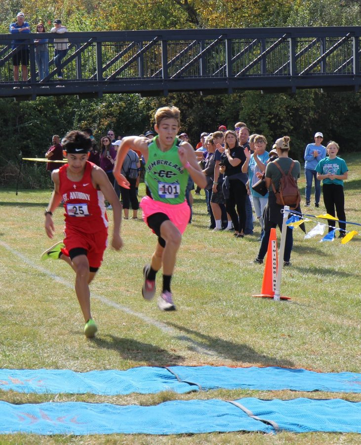 Giovanni Bucio (left) from St. Anthony races Kaleb Bierman (right) from Cumberland to the finish. Photo via Adam Alexander.