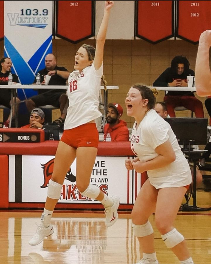 Devon Patrick is shown on the right jumping in the air as her team scores. Leah Erbentraut is shown on the left full of excitement towards the game. Photo via Devon Patrick. 