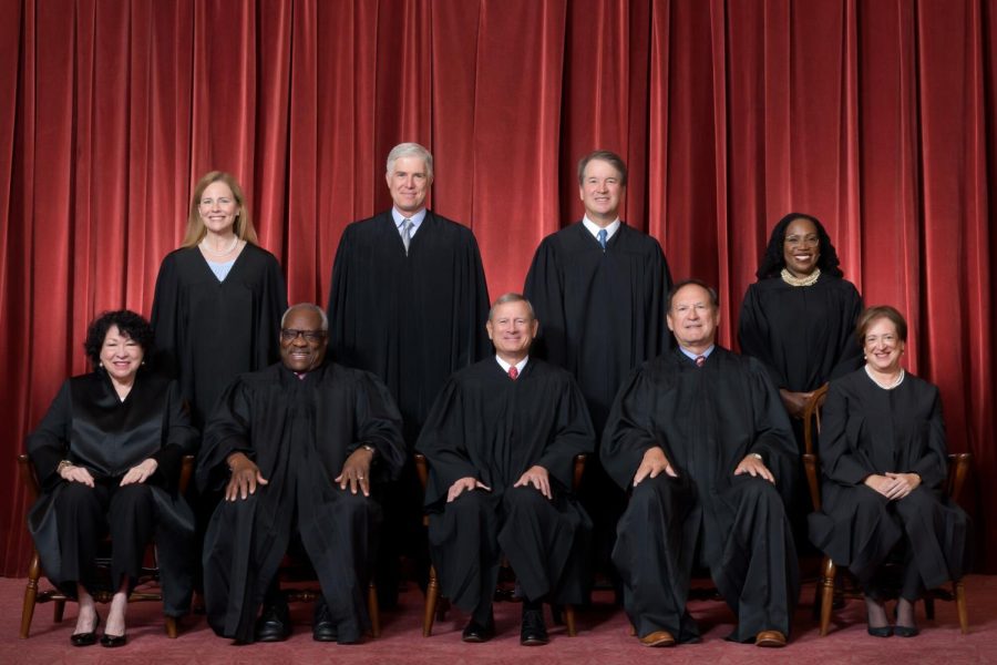 The current members of the supreme court. Photo via The New York Times.​