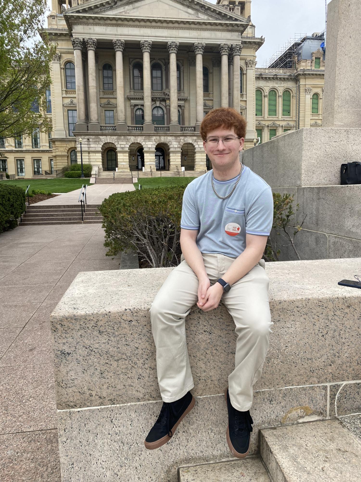 Robert, sitting in front of the Illinois State Capital, back in Apr. Photo provided by Robert Morse.
