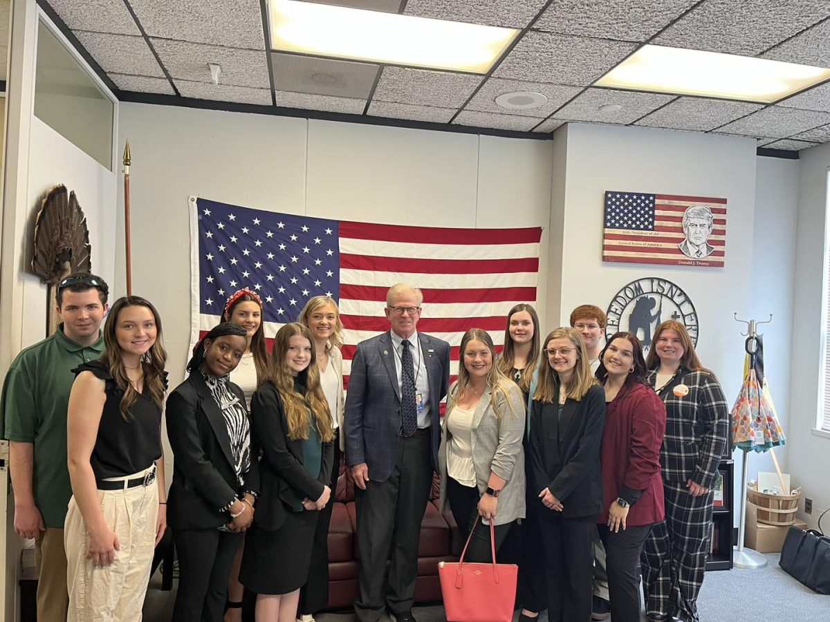 Group portrait of SGA and LLC Student Trustee posing with Representative Chris
Miller during their Springfield visit. Photo via Student Government Association via Facebook.