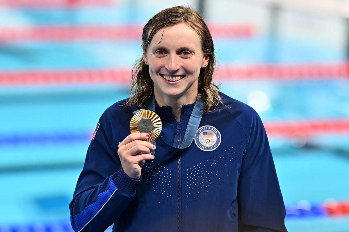 Katie Ledecky holding up one of her gold medals!