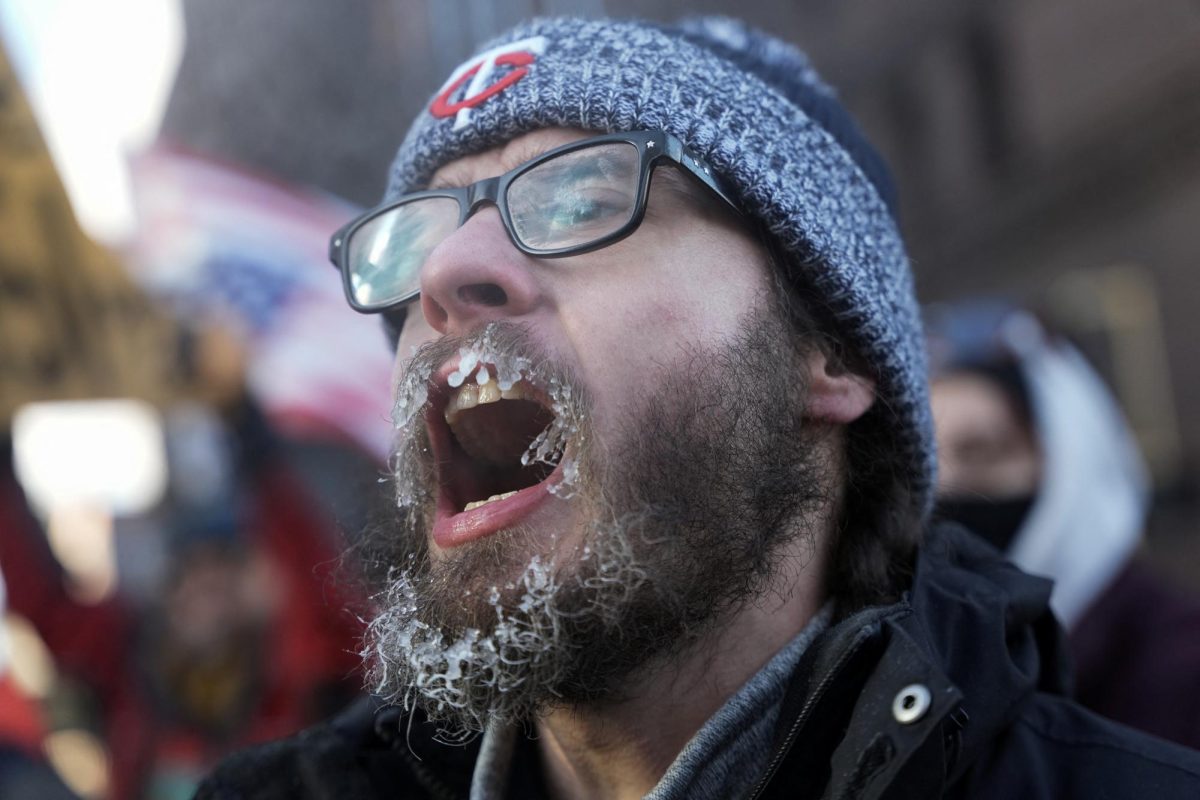 A protester with frozen facial hair, takes part in a rally on the day of a general strike to protest U.S. President Donald Trump's deployment of thousands of immigration enforcement officers on the streets of Minneapolis, Minnesota, U.S., January 23, 2026